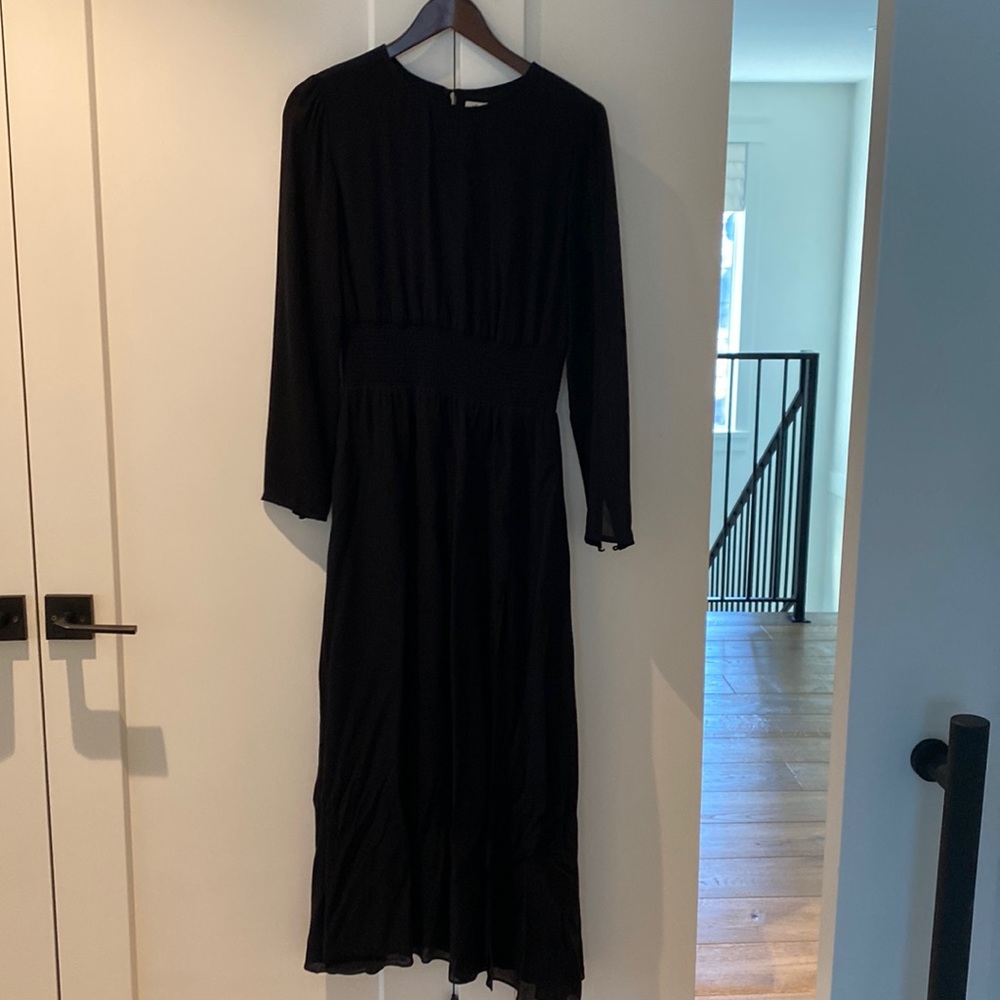 Wilfred long black dress with a cinched in elastic waist and see through arms